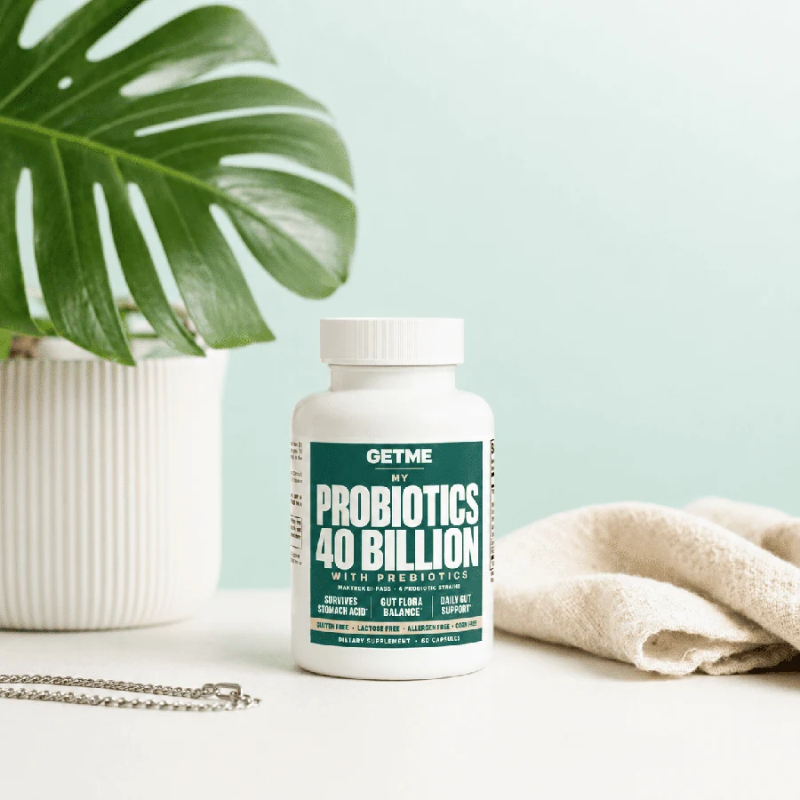 Getme Probiotics 40 Billion bottle on a light surface beside a plant and linen cloth